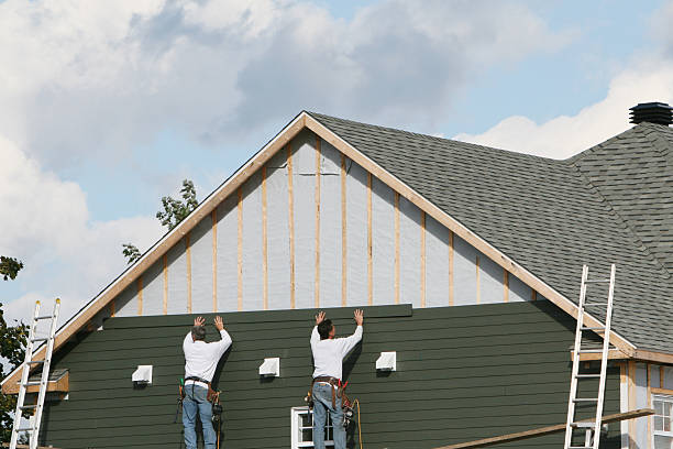 Professional Siding Installation technician working in Melrose, MA